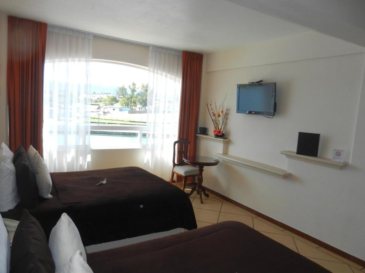 Hotel 9 Manantiales تشيغناهوابان المظهر الخارجي الصورة