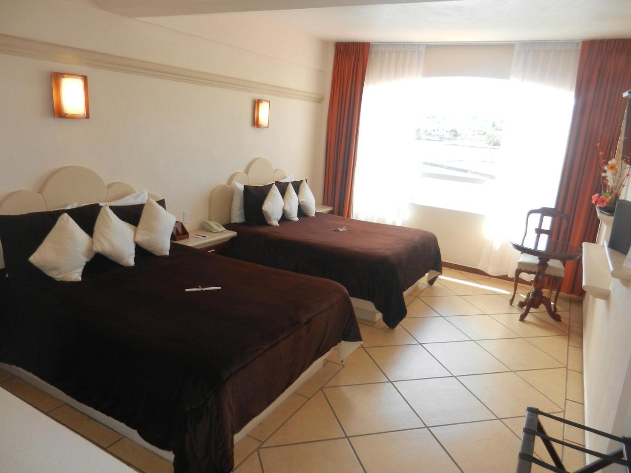 Hotel 9 Manantiales تشيغناهوابان المظهر الخارجي الصورة